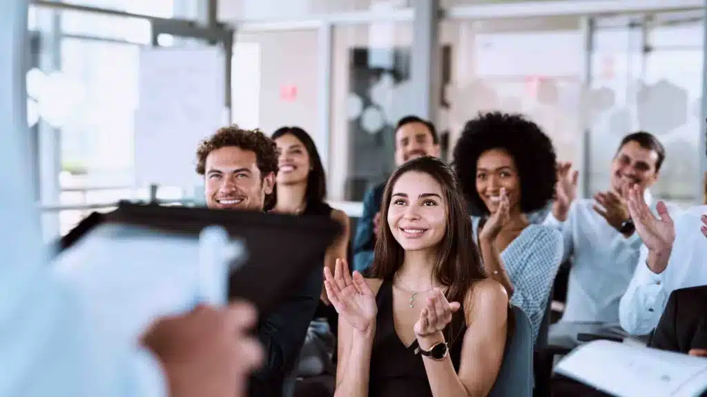 business people celebrating and applauding achievement of a professional or business goal