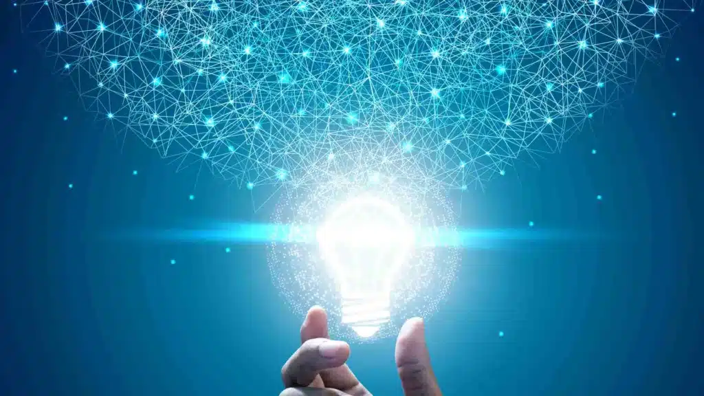 Lightbulb and hand, symbolizing picking the best idea